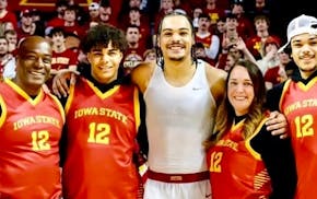 The Jones family of Prior Lake have three sons playing basketball this season. From left, father Kenderick; William, a junior at Prior Lake High; Robe