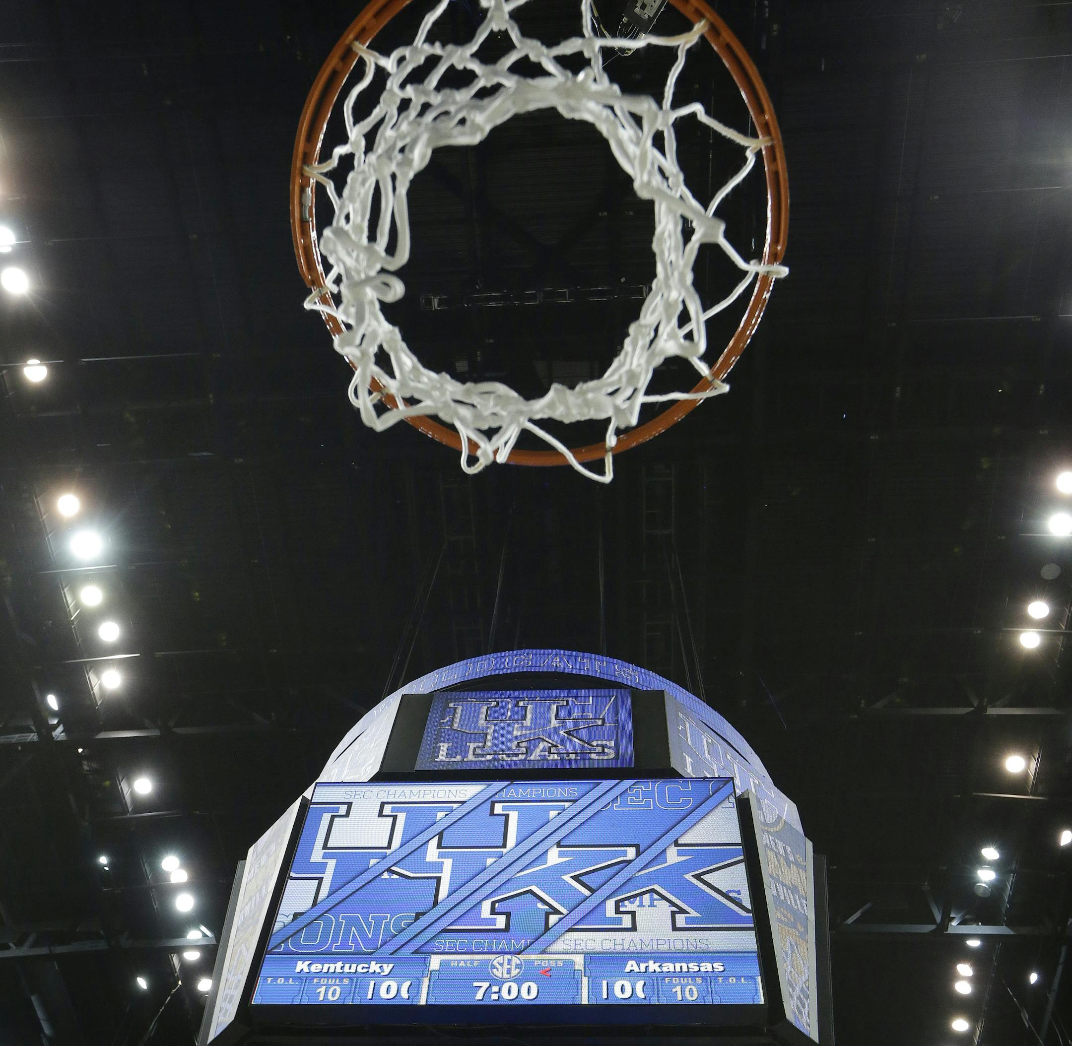 The net remains as Kentucky team members didn't cut them down after the NCAA college basketball Southeastern Conference tournament championship game against Arkansas, Sunday, March 15, 2015, in Nashville, Tenn. Kentucky won 78-63. Kentucky won 78-63. (AP Photo/Mark Humphrey)