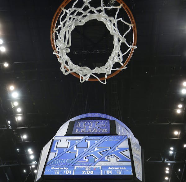 The net remains as Kentucky team members didn't cut them down after the NCAA college basketball Southeastern Conference tournament championship game a