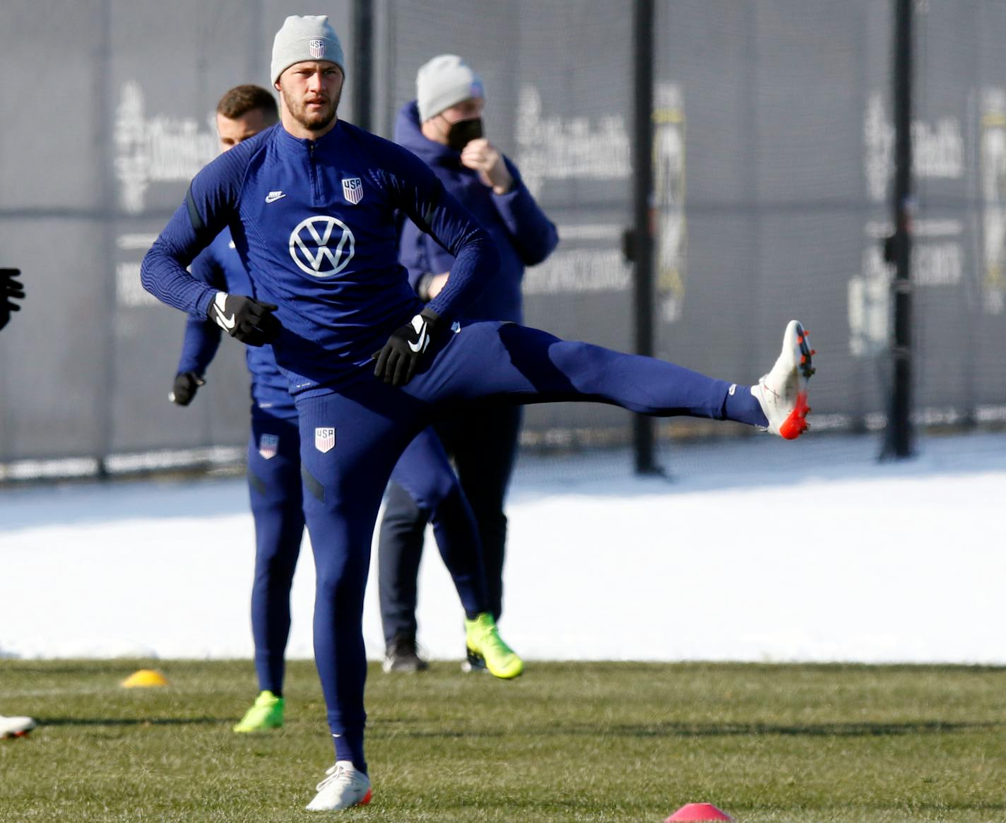 U.S. men's national team soccer defender Walker Zimmerman stretches during practice in Columbus, Ohio, Wednesday, Jan. 26, 2022, ahead of Thursday's World Cup qualifying match against El Salvador. (AP Photo/Paul Vernon)