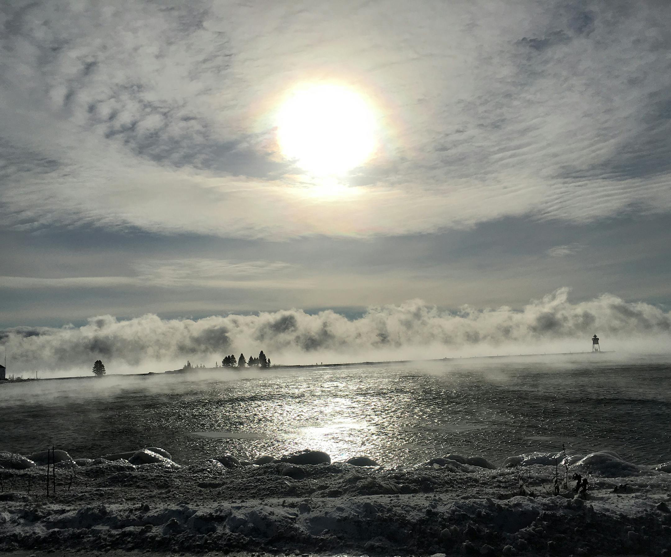 These photos were taken on our 6th annual Christmas-New Years week at Blue Fin Bay Resort in Tofte, Minnesota.
My husband and I always go out hiking on a variety of trails on the North Shore during our stay. Some years have been a bit warmer but this year was a bit more challenging with the colder temperatures. This does not stop us though! We bundle up and head out on the trails! The views of the lake, rivers, falls. and trails are really quite spectacular in winter!! Photo 1: Picture on the Dy