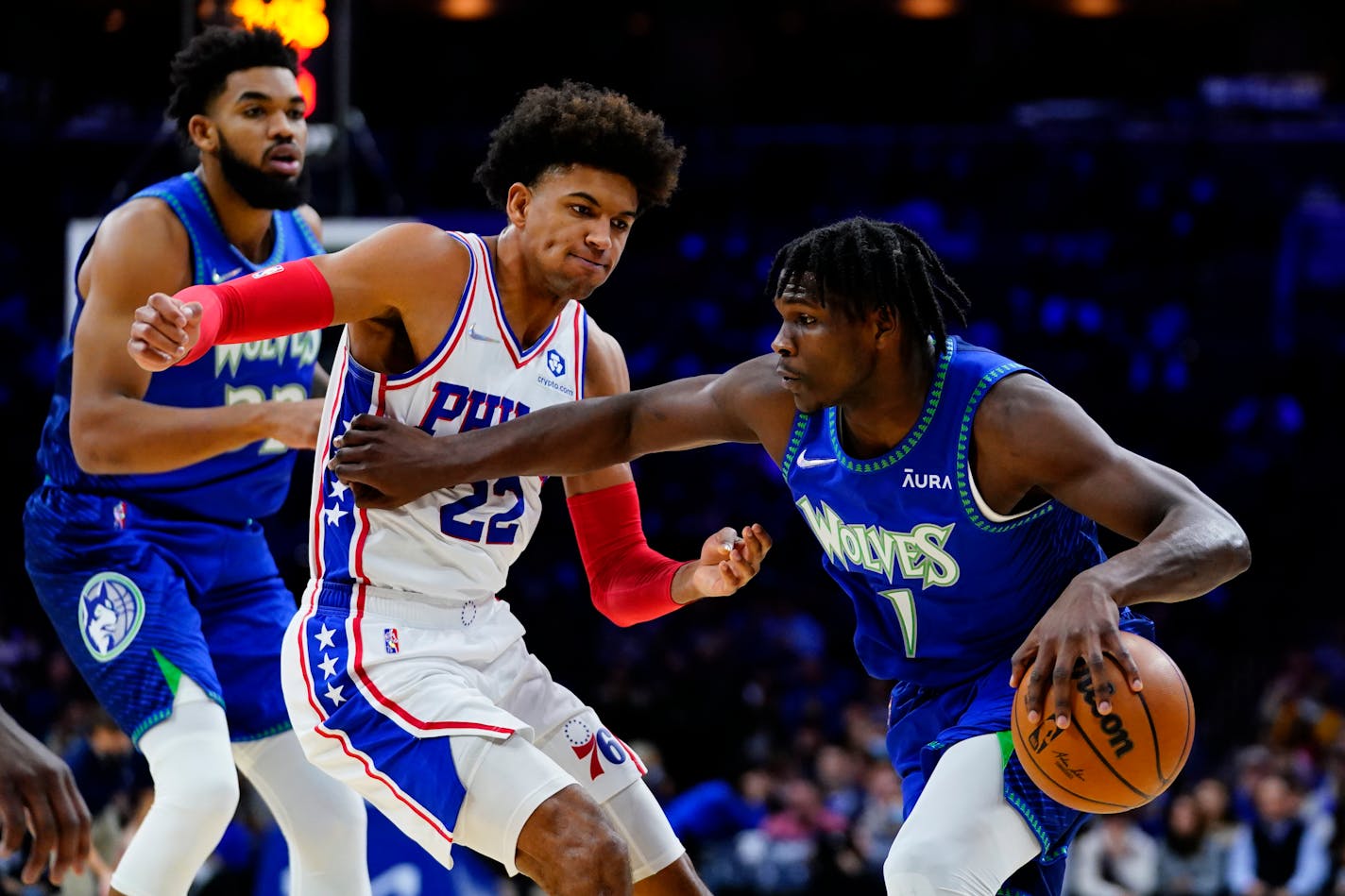 Timberwolves' Anthony Edwards tries to get past Philadelphia's Matisse Thybulle during the first half