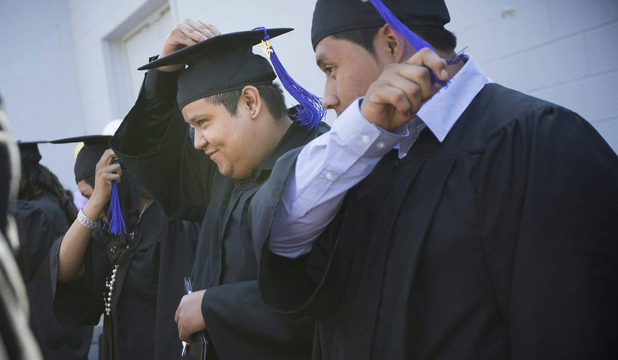 Angel Onofre moved his hassle from left to right after the announcement that the 16 studentsat the El Colegio were now officially graduates at the graduation ceremony at the school in Minneapolis, Minn., on Friday, June 5, 2015. ] RENEE JONES SCHNEIDER • reneejones@startribune.com Angel Onofre was ready to ditch school. Depression and a conversation with his parents, who live in Mexico, left him feeling worthless. But when he went in to tell the principal of El Colegio that he was droppin