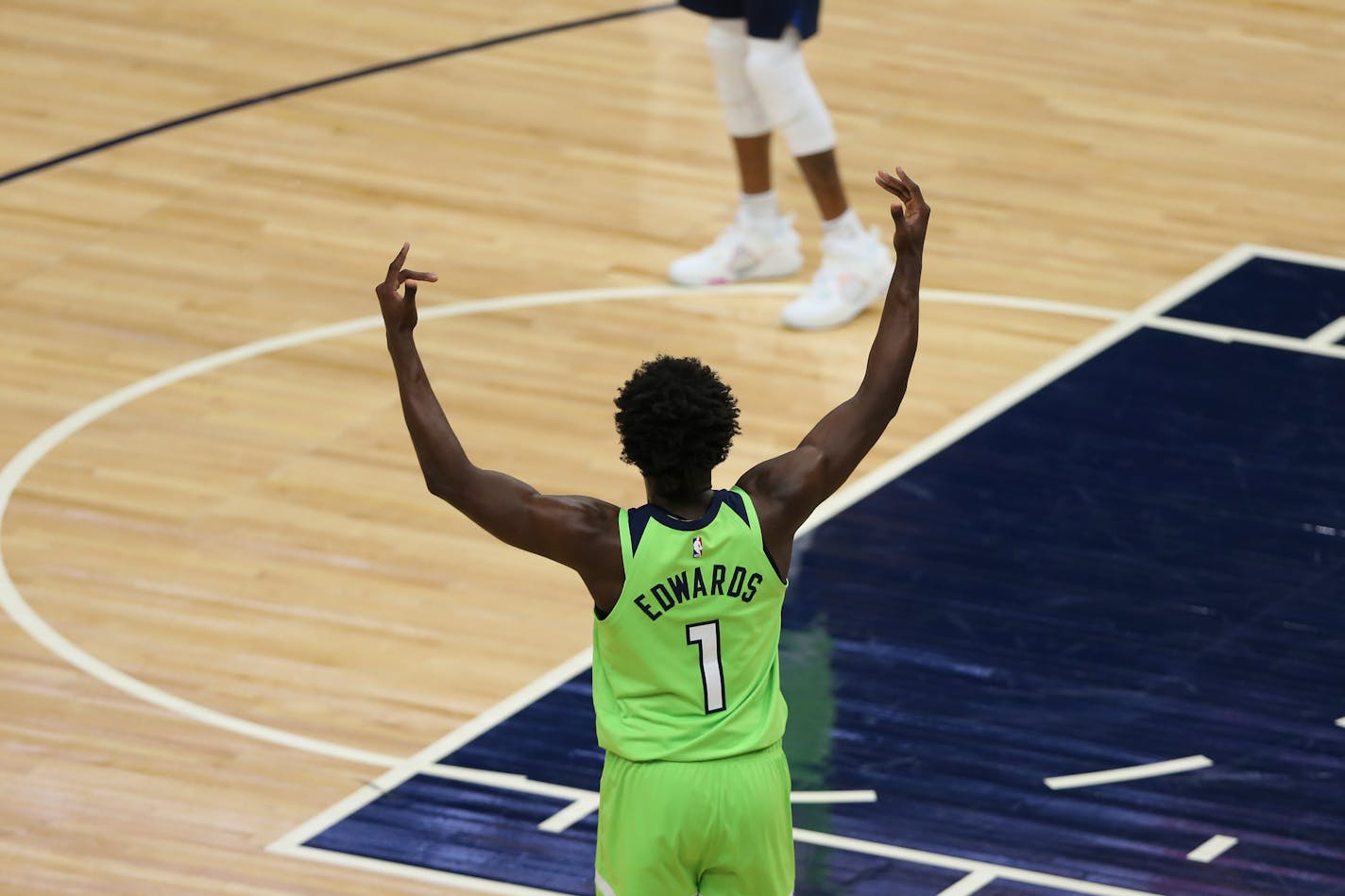 Minnesota Timberwolves' Anthony Edwards (1) celebrates a three-pointer during the first half of an NBA basketball game against the New Orleans Pelicans, Saturday, May 1, 2021, in Minneapolis. New Orleans won 140-136 in overtime. (AP Photo/Stacy Bengs)