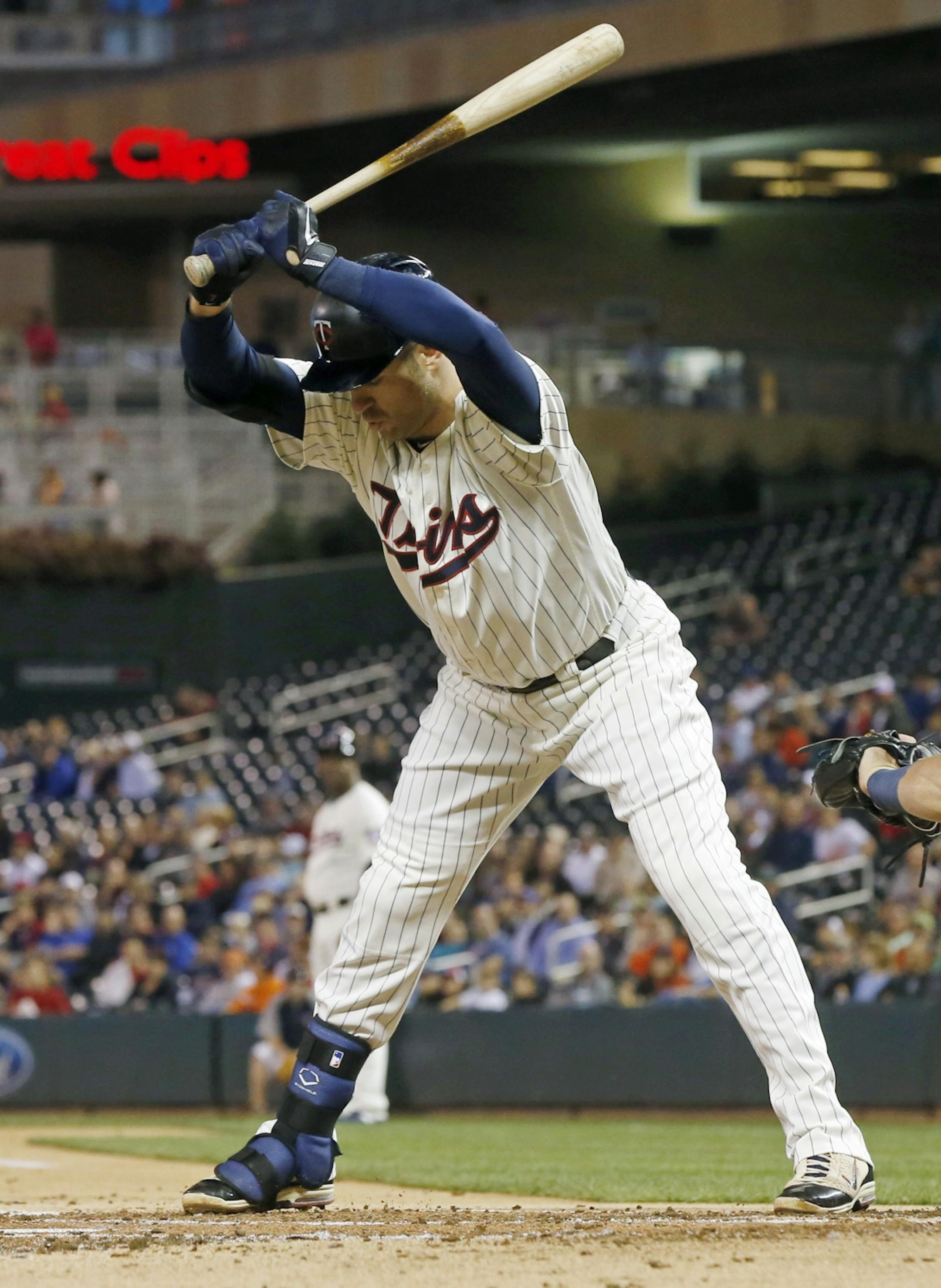 Minnesota Twins' Joe Mauer avoids a close pitch by Detroit Tigers pitcher Buck Farmer in the first inning of a baseball game Wednesday, Sept. 21, 2016, in Minneapolis.