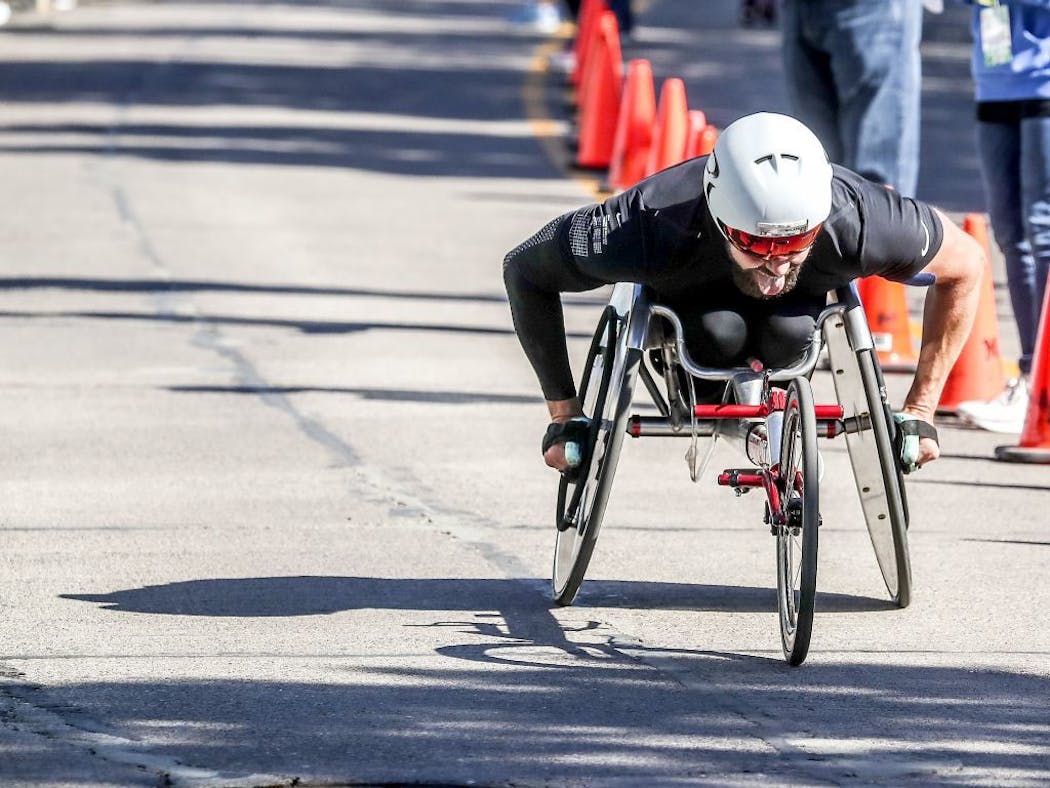 Aaron Pike of Savoy, Ill. pushes his wheelchair Saturday at the finish line area of the Grandma's Marathon in Canal Park in Duluth.