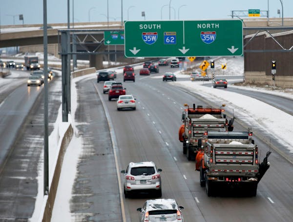 Plows filled with road salt make their way west on Highway 62 near the interchange with I-35W after overnight snowfall Thursday, Nov. 29, 2018, in Ric