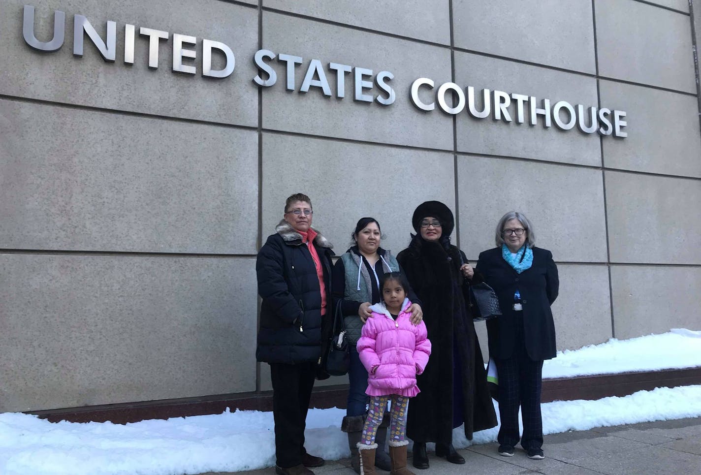 From left to right: Lourdes Vargas, Aurora Saenz, Esmeralda Meneses, Jurline Bryant and Linda Soderstrom, former tenants of the Crossroads at Penn apartments in Richfield, stand outside the federal court building in downtown Minneapolis on Tuesday, Jan. 23, 2018.