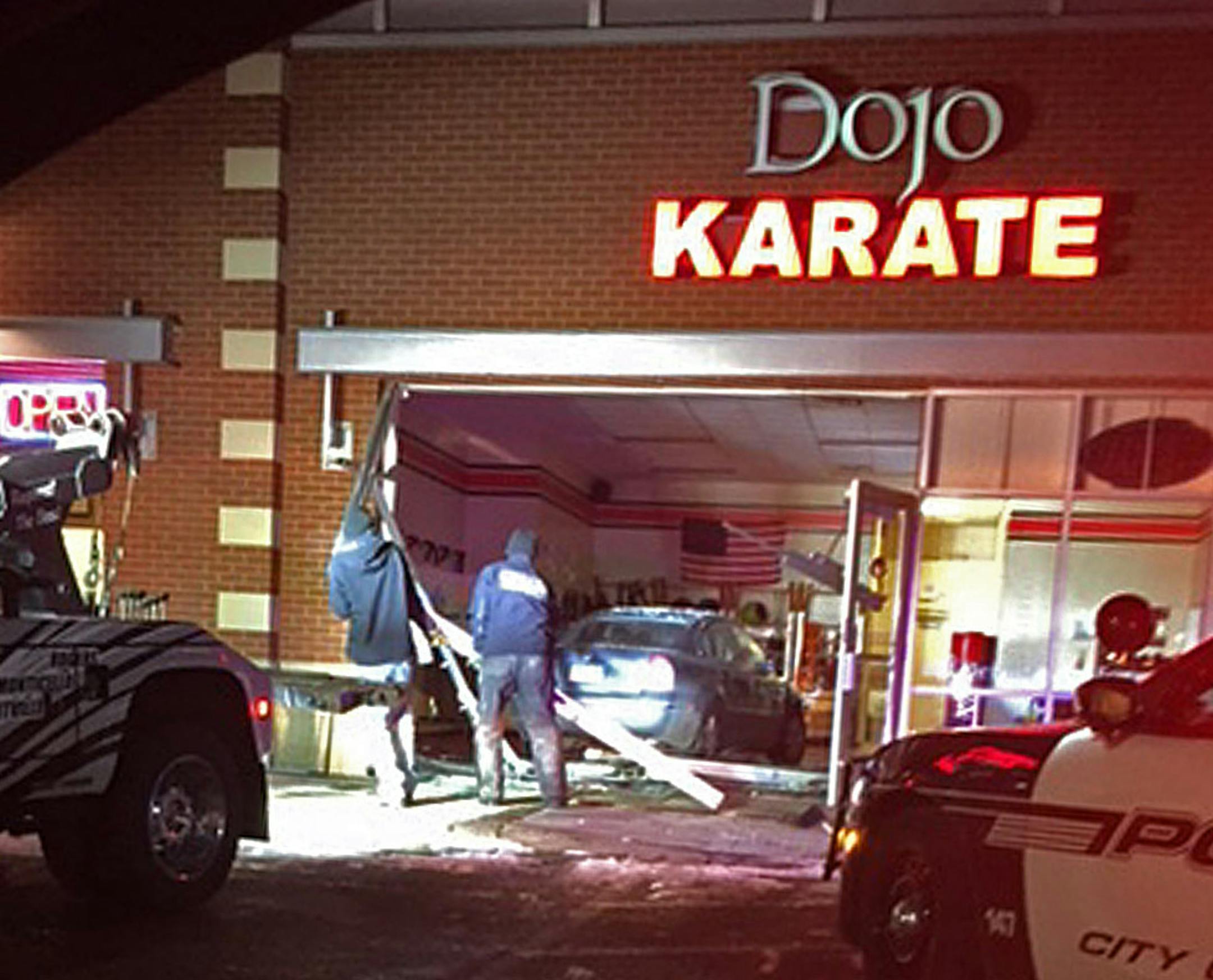 A car went through the front window of the Dojo Karate studio in Medina on Friday. The business was closed at the time and no one was seriously hurt. Photo provided by Brian Larson