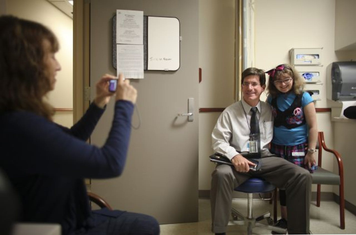 Dr. John Wagner, accused a decade ago of playing God, visited with Molly Nash last week while she was back at the University of Minnesota for a 10-year checkup after her bone marrow transplant.