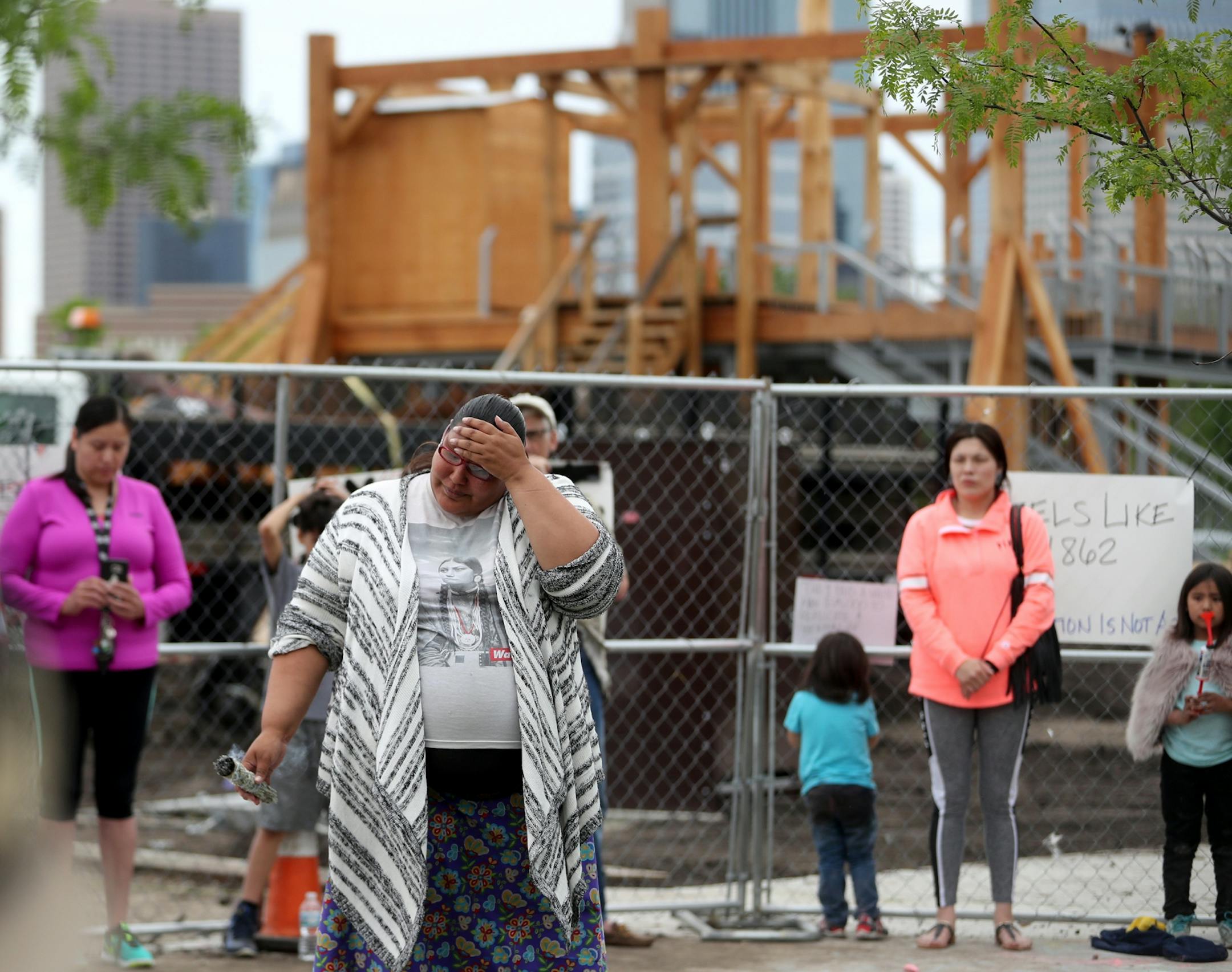 A new sculpture at the Walker Art Center that prompted an outcry among Minnesota's American Indian communities will be dismantled, the director said Saturday. Here, Crystal Norcross, a Sisseton Wahpeton Dakota from Sisseton S.D., spoke to a crowd near the piece, "Scaffold."