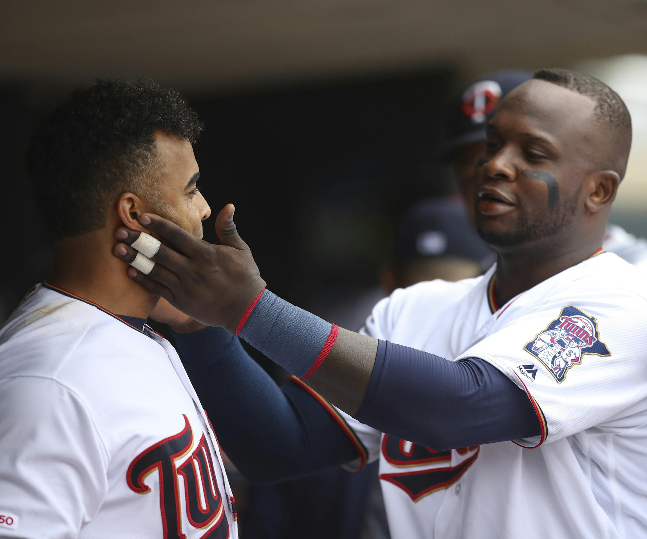 Miguel Sano congratulated Nelson Cruz on his 40th home run of the season in the final regular-season home game.