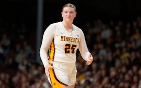 Minnesota's Grace Grocholski, shown against UConn on Nov. 19, hit an important three-pointer late in Wednesday night's 74-69 win at Troy (Ala.).