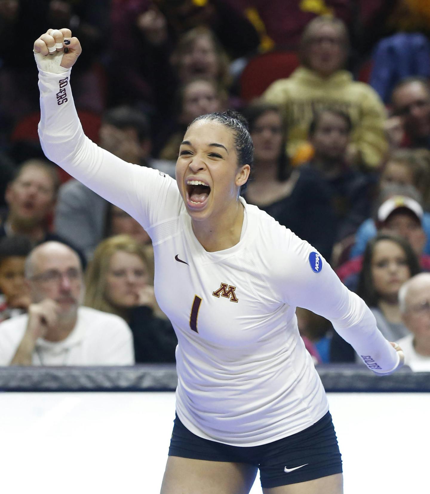 Minnesota's Daly Santana (1) celebrates a point against Hawaii Saturday, Dec. 12, 2015, during the NCAA Division I Women's Volleyball Championship in Des Moines, Iowa. (The Des Moines Register, Michael Zamora/The Des Moines Register via AP)