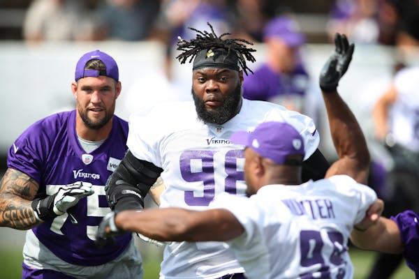 Minnesota Vikings defensive tackle Linval Joseph (98) worked on like drills with offensive guard Alex Boone (75), and defensive end Danielle Hunter (9