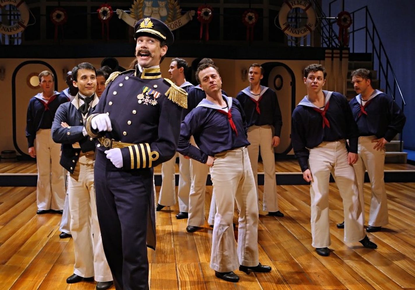 Robert O. Berdahl (Captain Corcoran) and the sailors from the cast of the Guthrie Theater's production of "H.M.S. Pinafore."