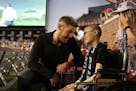 Minnesota United goalkeeper Matt Lampson (28) talked with Nathalia Hawley, 14, who was diagnosed with the bone cancer osteosarcoma when she was in six