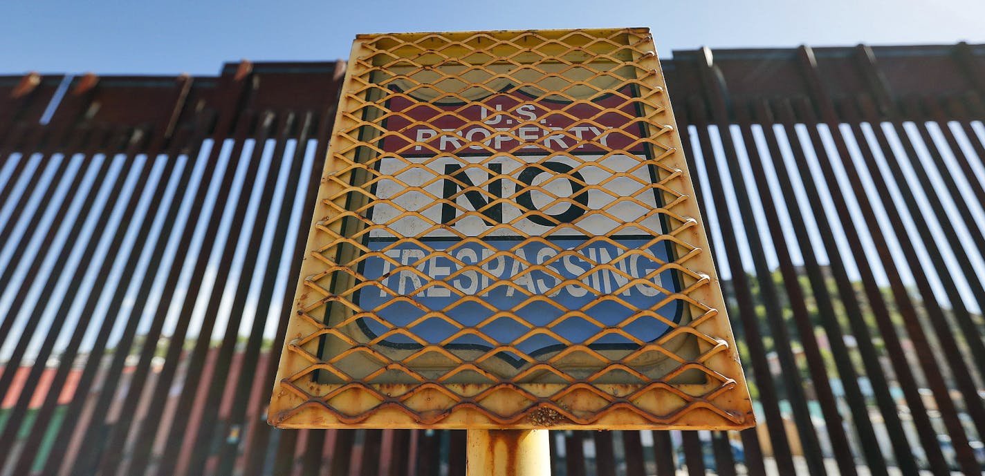 FILE - In this April 9, 2018, file photo, the international border between Mexico and the United States is seen from Nogales, Ariz. Russians, Peruvians and Mexicans were among over 70 immigrants arrested last week in Arizona during a weeklong operation by U.S. Immigration and Customs Enforcement, officials said Friday, Aug. 31, 2018. (AP Photo/Matt York, File)