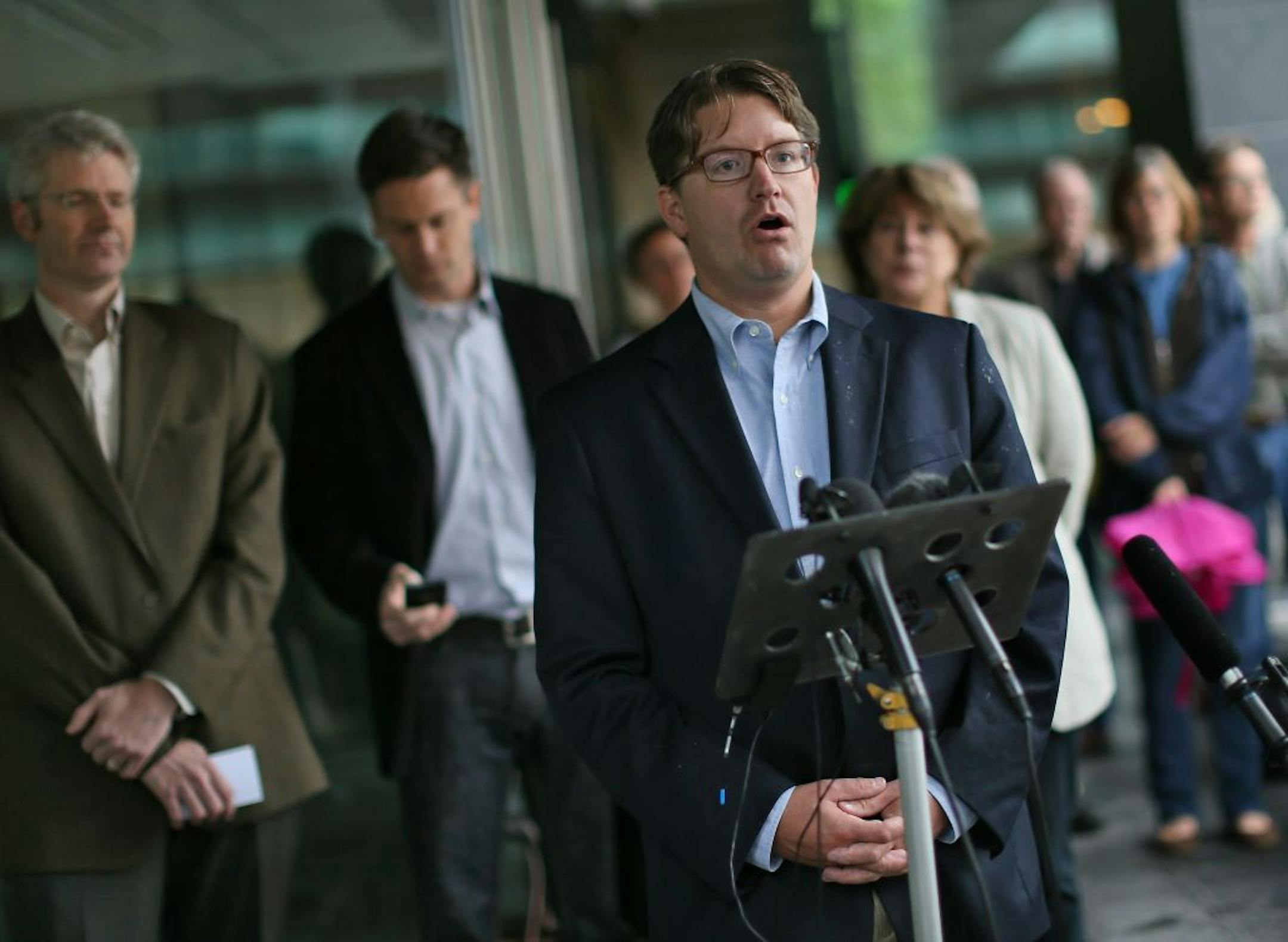 Spokesman Blois Olson said Minnesota Orchestra musicians voted unanimously Saturday, 60-0, against an offer from management. Behind Olson, from left, are musician/negotiators Doug Wright, Kevin Watkins and Marcia Peck.