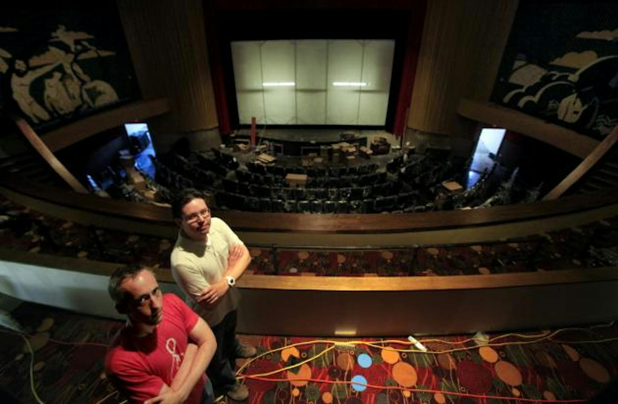 Bryan Linington, Landmark Theatres' vice president of technology, and project manager Erich Paraso stood amid the restored glory of the Uptown Theater. (Photo by Joel Koyama)