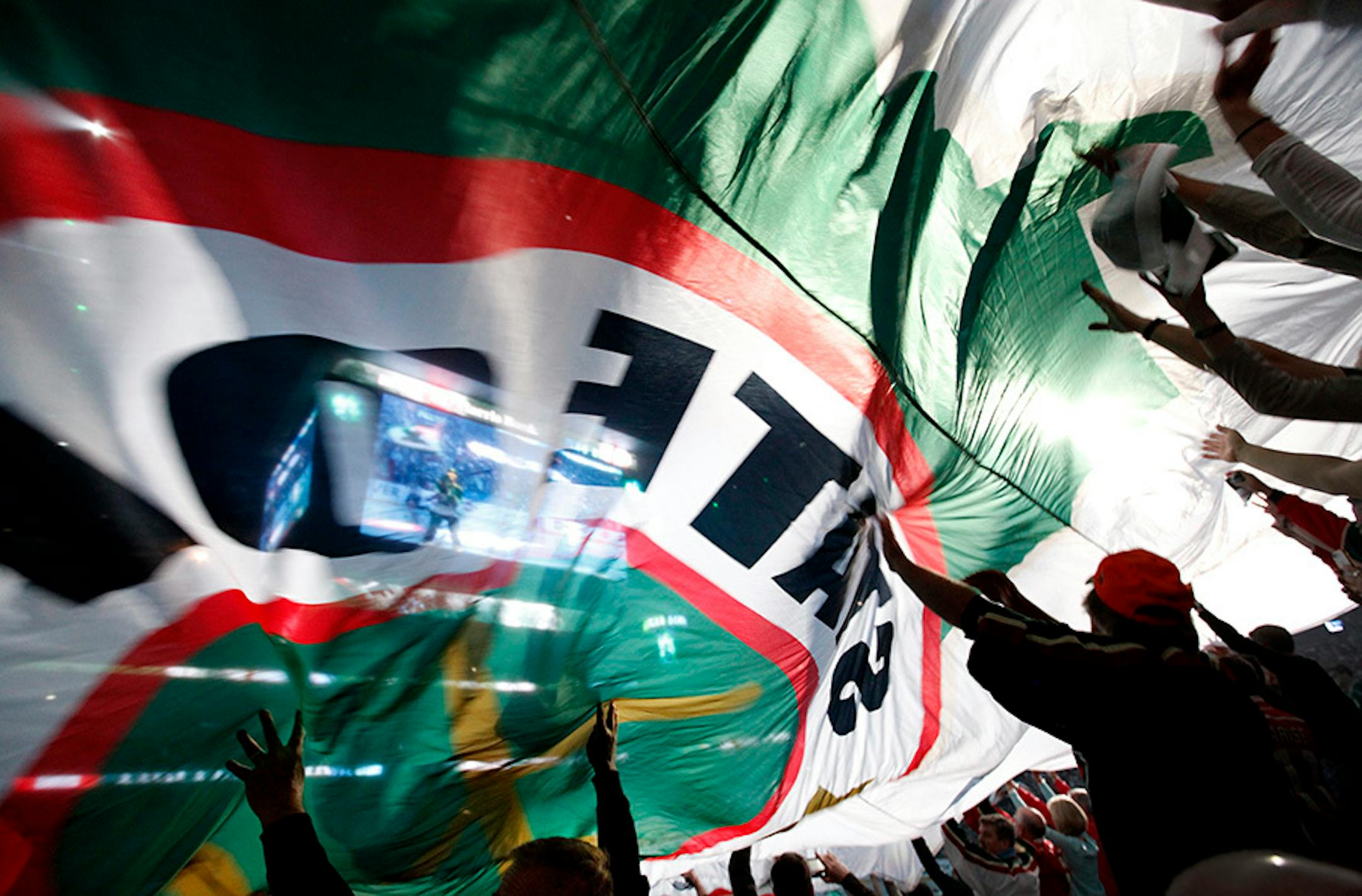 Fans in the stands passed the State of Hockey flag during the pregame festivities before the start of game 3 between the Minnesota Wild and Dallas Stars.