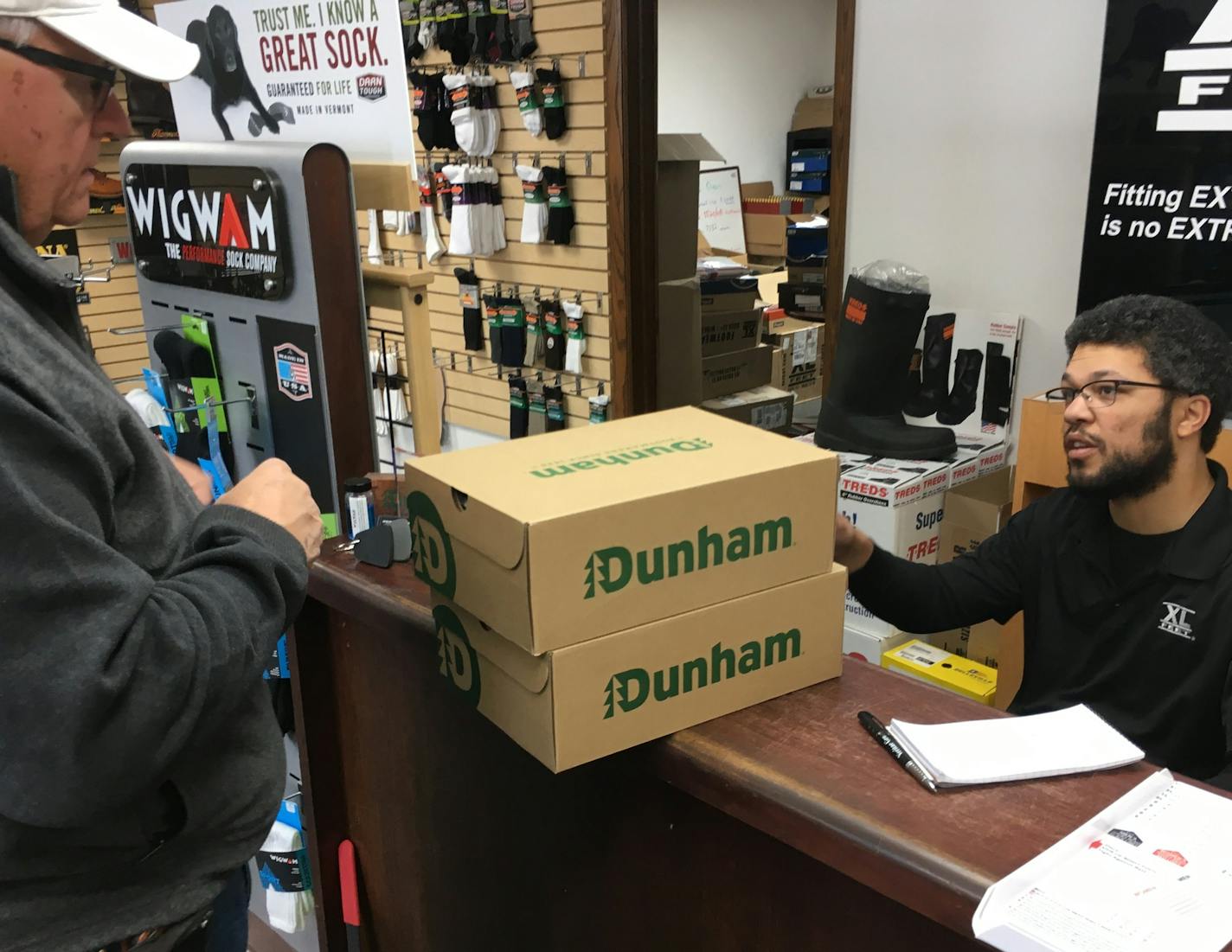 Dr. Terry Domino of Hudson, Wi., acquired a pair of size 14 Dunham boat shoes from Adrian Coulter at Coulter's store in St. Paul on a Saturday in December. Photo: Neal.St.Anthony@startribune.com