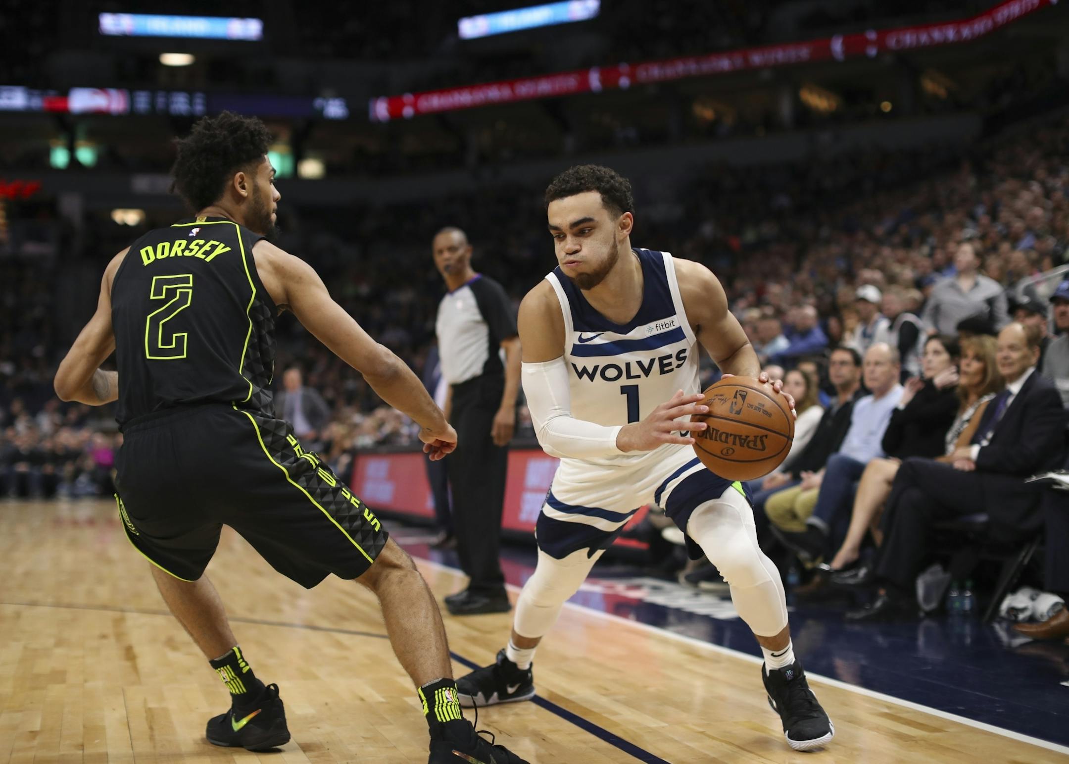 Minnesota Timberwolves guard Tyus Jones (1) made a move around Atlanta Hawks guard Tyler Dorsey (2) in the third quarter.