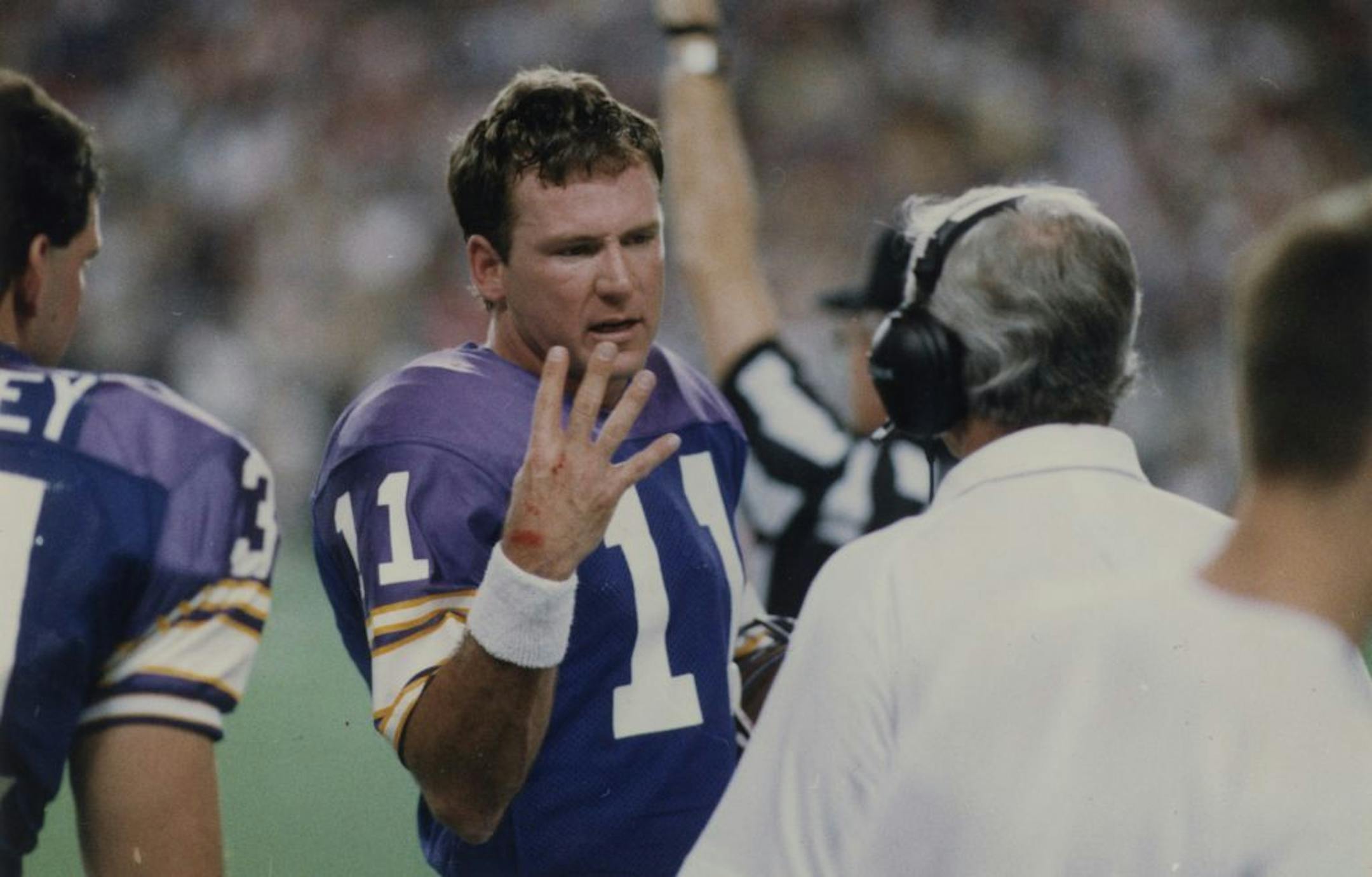 Minnesota Vikings pro football -- quarterback Wade Wilson (11) is shown during a game (possibly Monday December 19, 1988, though published caption writes around that). Photo by Star Tribune staff photographer David Brewster ran Wed., Dec. 21, 1988.