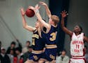 Sean Sweeney, middle, works for a rebound with Cretin-Derham Hall teammate Joe Mauer against Highland Park's Maurice Hargrow on Feb. 13, 2001, helping