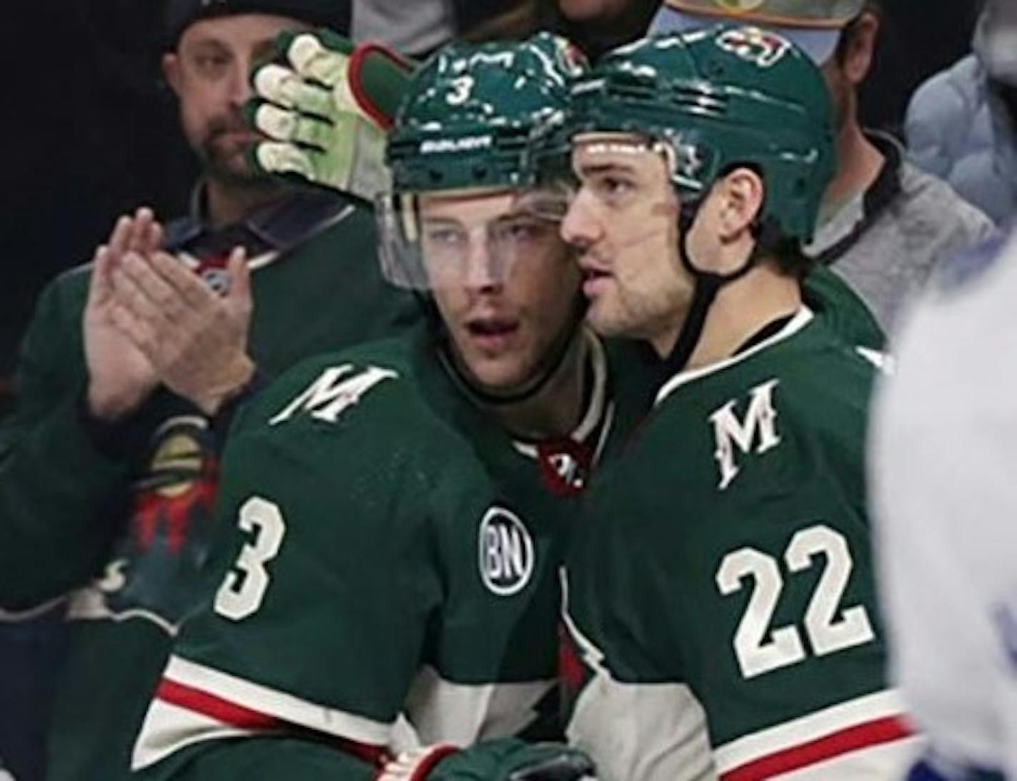 Charlie Coyle, left, and Nino Niederreiter with the Wild.