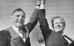 November 3, 1980 CO-CAMPAINERS -- President Jimmy Carter (right) and Vice-President Walter Mondale share a victory salute at the Akron-Canton Municipa