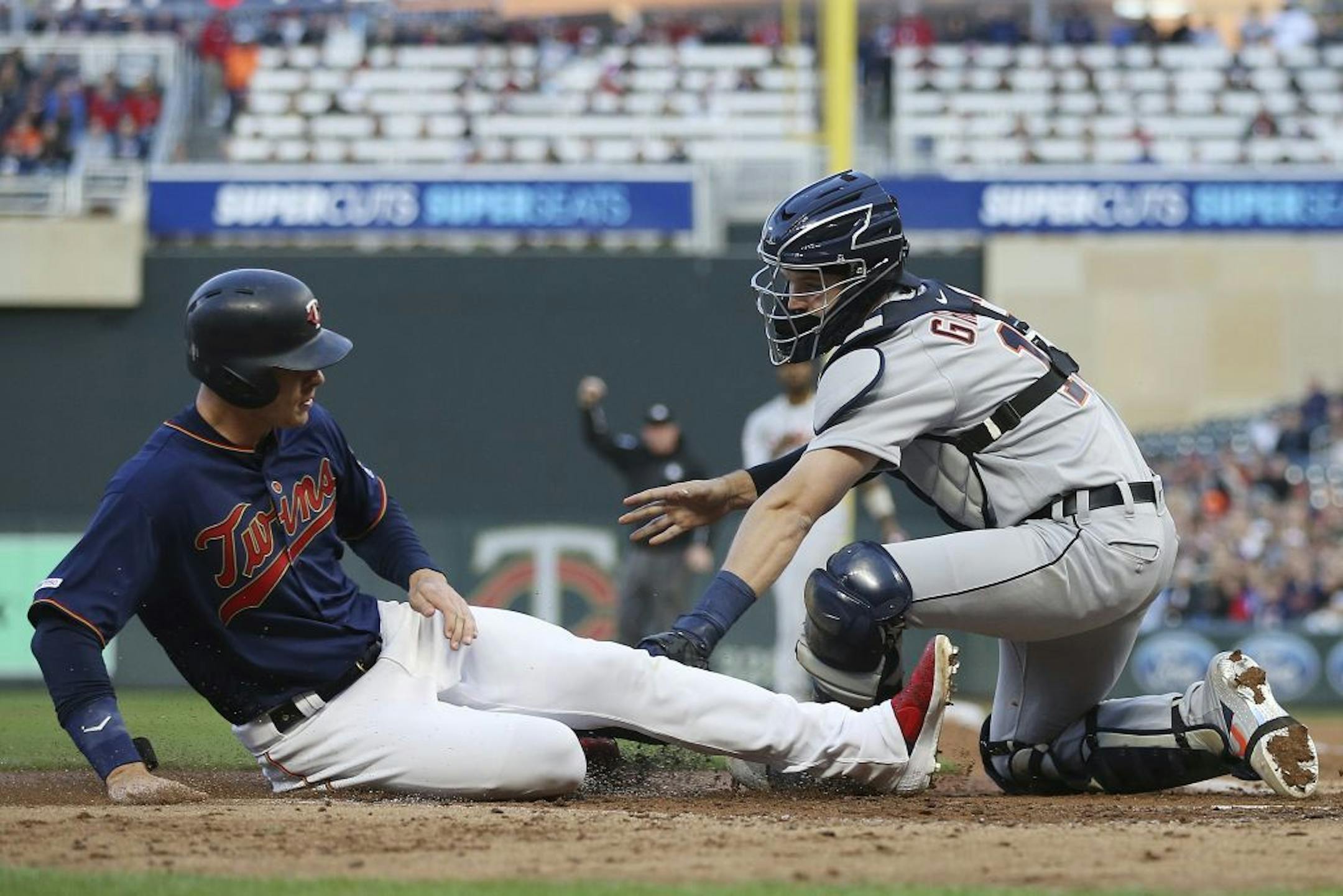 Minnesota Twins' Max Kepler is tagged out at home by Detroit Tigers catcher Grayson Greiner during the third inning of a baseball game Friday, May 10, 2019, in Minneapolis.