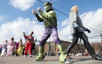 Keaton Maros, 6, of Ramsey, walked with his mother, Michele, during Friday's parade in Anoka. ] (AARON LAVINSKY/STAR TRIBUNE) aaron.lavinsky@startribu