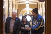 In 2019, Gov.-elect Tim Walz, meeting in 2019 with Jesse Ventura, a former governor of Minnesota.