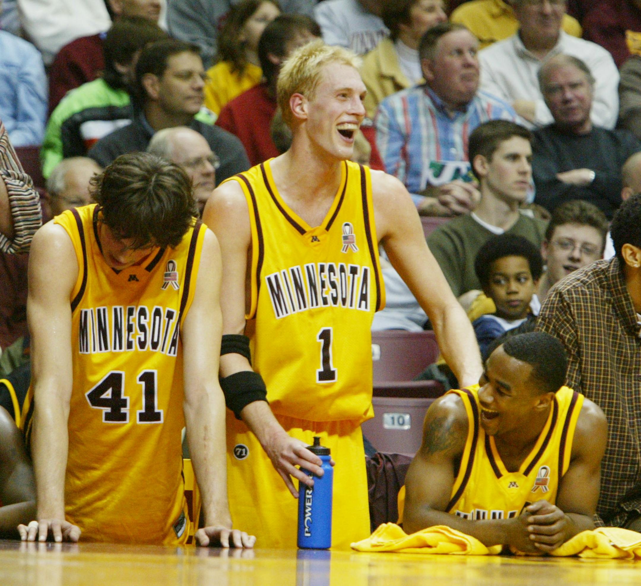 Minneapolis,MN;2/22/03:Left to right:Gophers Michael Bauer, Rick Rickert, and Aaron Robinson celebrate the team win over Penn State. Rickert was the high scorer.