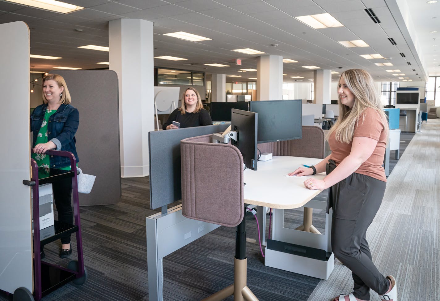 Stacy Brandberg, left, Liz Olberding and Natasha Fonville of Atmosphere Commercial Interiors.