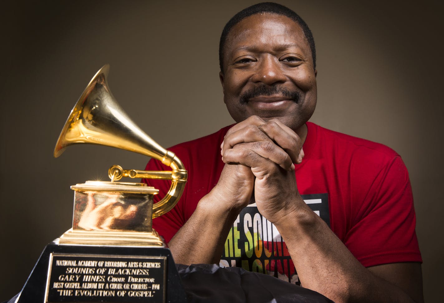 Gary Hines, music director and producer for the group Sounds of Blackness with his Grammy award at Sabathani Community Center in Minneapolis on Wednesday, February 10, 2016. ] (Leila Navidi/Star Tribune) leila.navidi@startribune.com