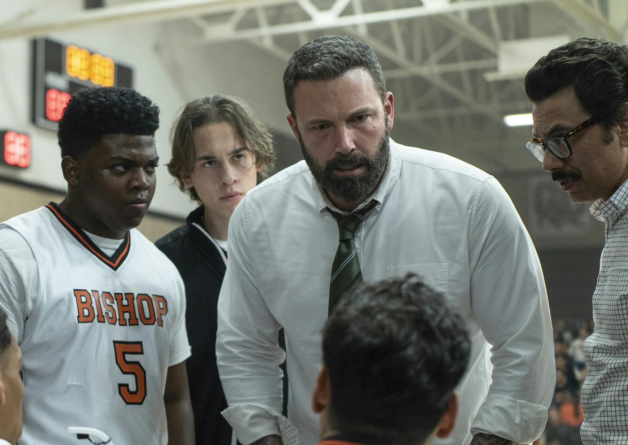 This image released by Warner Bros. Pictures shows Charles Lott Jr., left, Ben Affleck and Al Madrigal in a scene from "The Way Back." (Richard Foreman/Warner Bros. Pictures via AP)