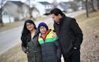 Kuhu Singh with her husband Rajeev and their son Puru, 12, walked through their Eden Prairie neighborhood.
