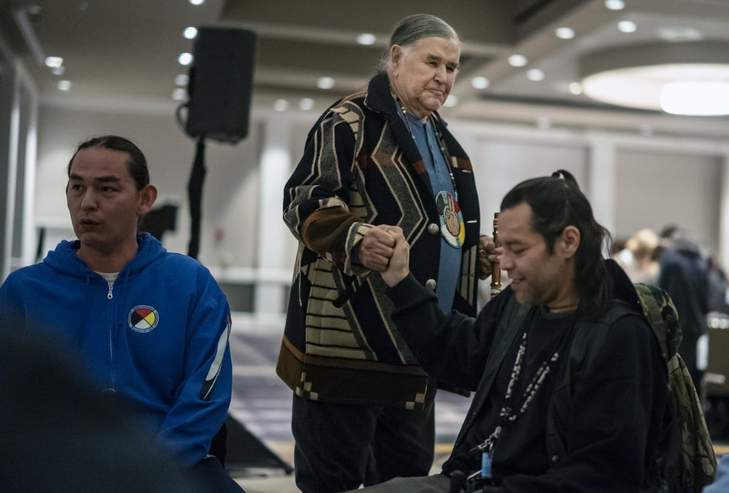 Clyde Bellecourt, center, attended a dinner for American Indian nonprofits in early February in St. Paul, where he offered a prayer for children and the homeless.