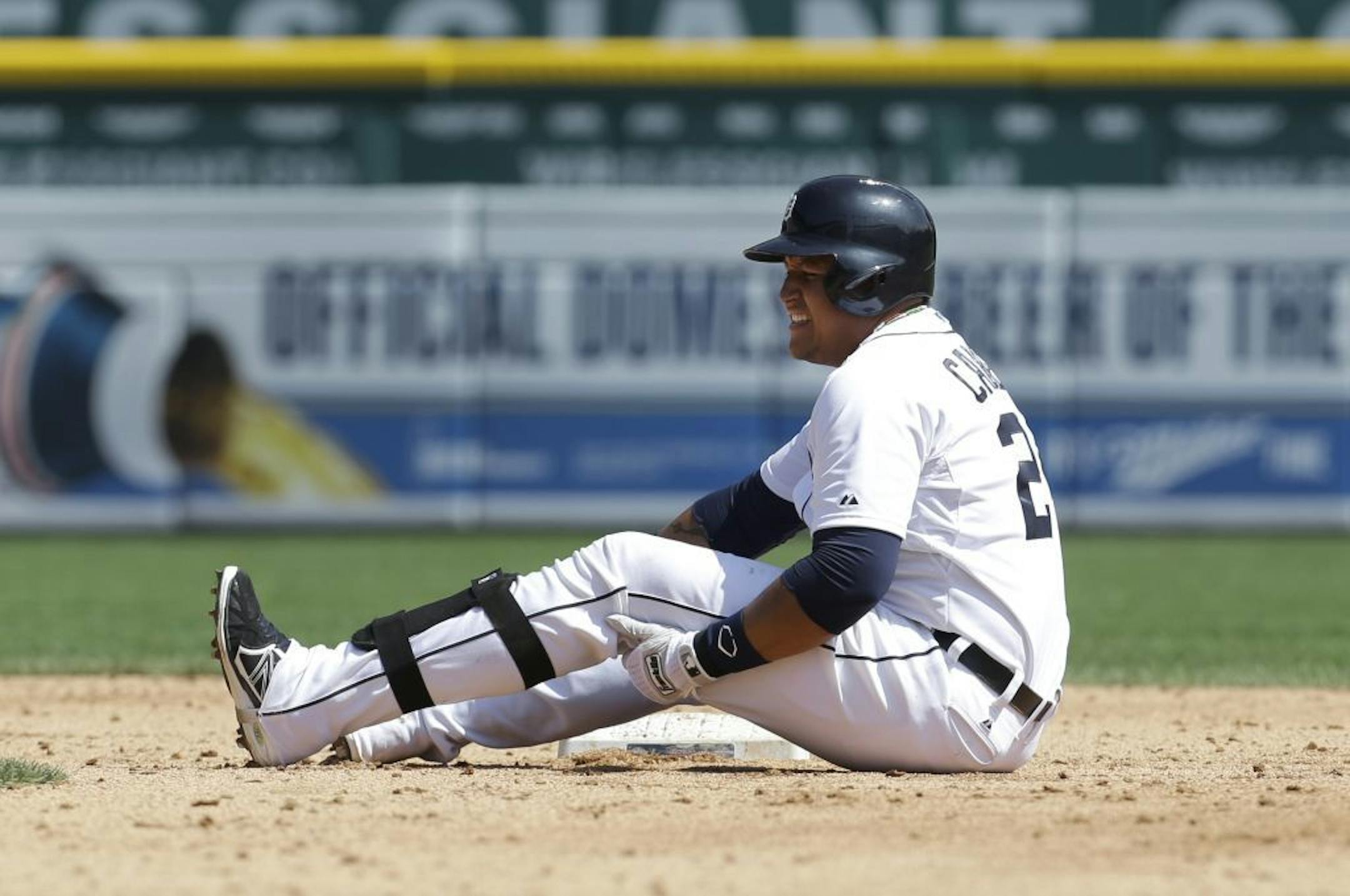 Detroit Tigers' Miguel Cabrera grabs his leg after being tagged out sliding into second base against the Oakland Athletics in the fifth inning of a baseball game in Detroit, Thursday, Aug. 29, 2013. Cabrera left the game.