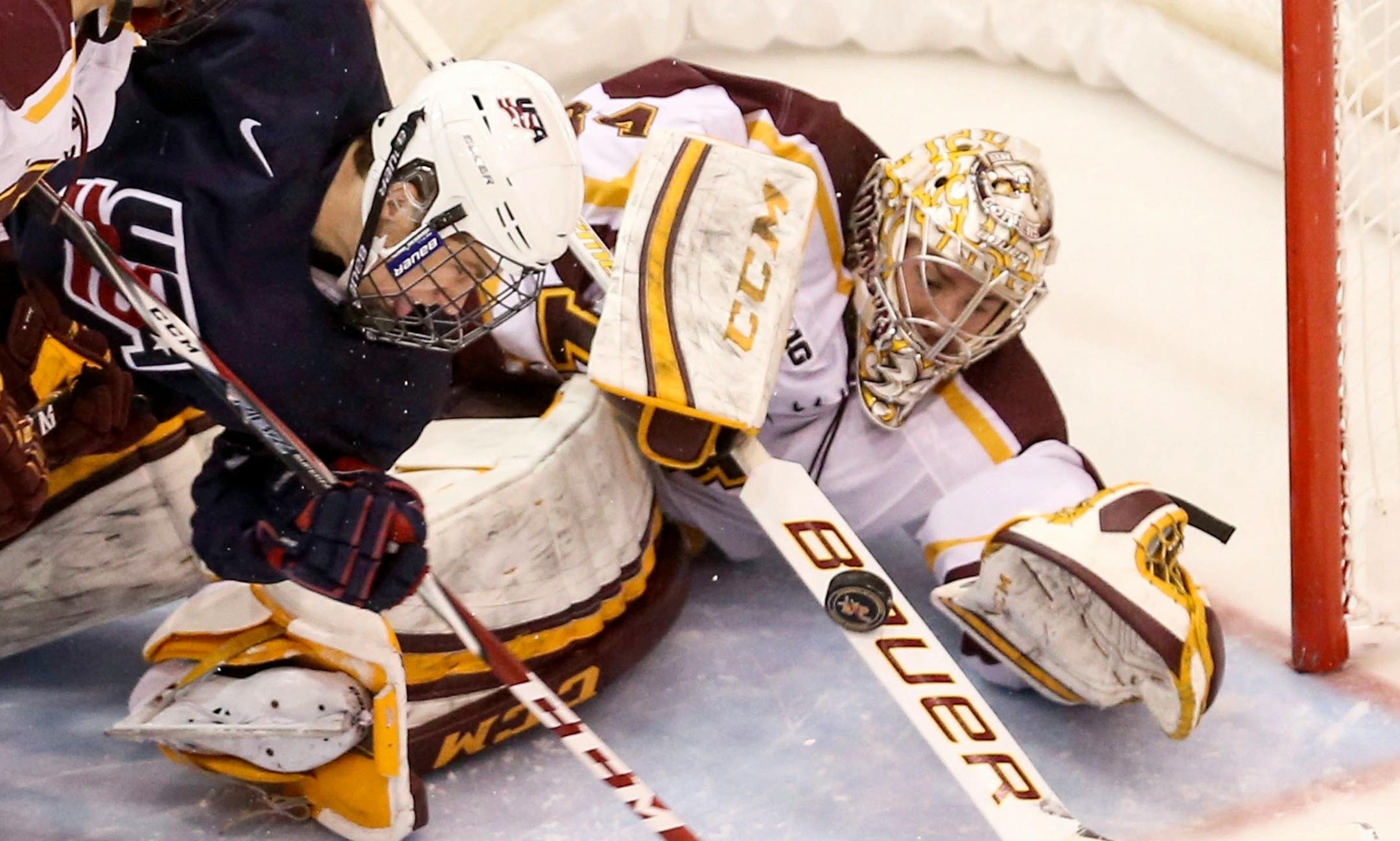 University of Minnesota Gophers goalie Nik Lehr (34) makes a stop on a shot by US U-18's Matthew Tkachuk (7) during first period action of their exhibition game Friday, Nov. 21, 2014, at Mariucci Arena on the University of Minnesota Campus in Minneapolis, MN..](DAVID JOLES/STARTRIBUNE)djoles@startribune Gophers men's hockey game, vs US U-18 team, exhibition game ORG XMIT: MIN1411211954125935