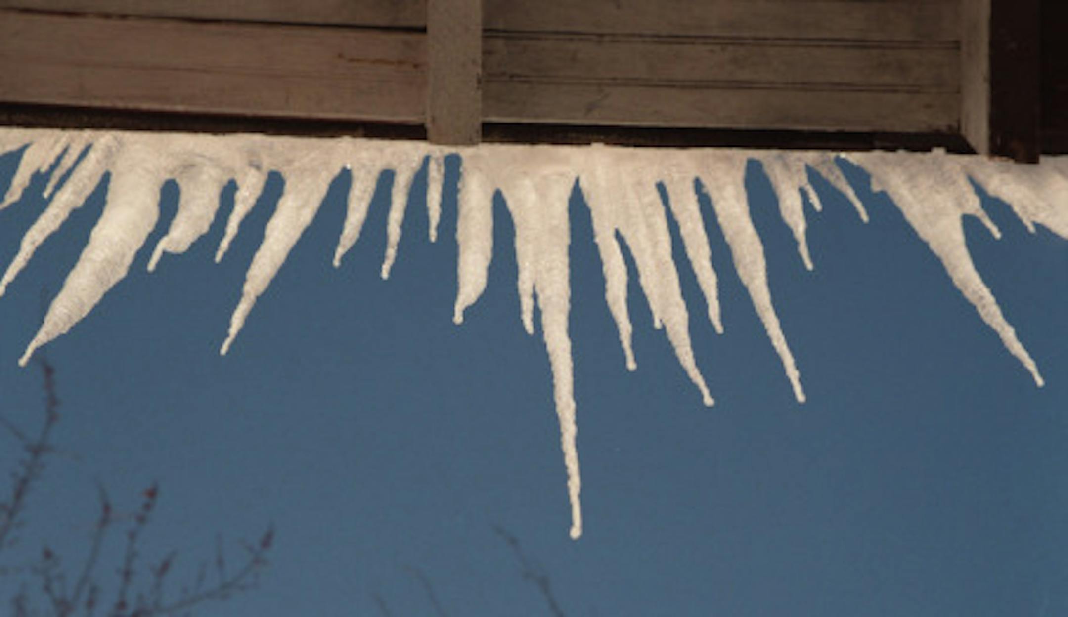 -- snow.5667- detail iceles hanging off the south facing roof edge- illo for ice-dam story?