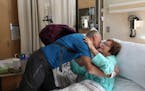 Gerard Murphy shared a hug with his friend Kathy Kehrberg who he donated a kidney to before heading home Thursday.