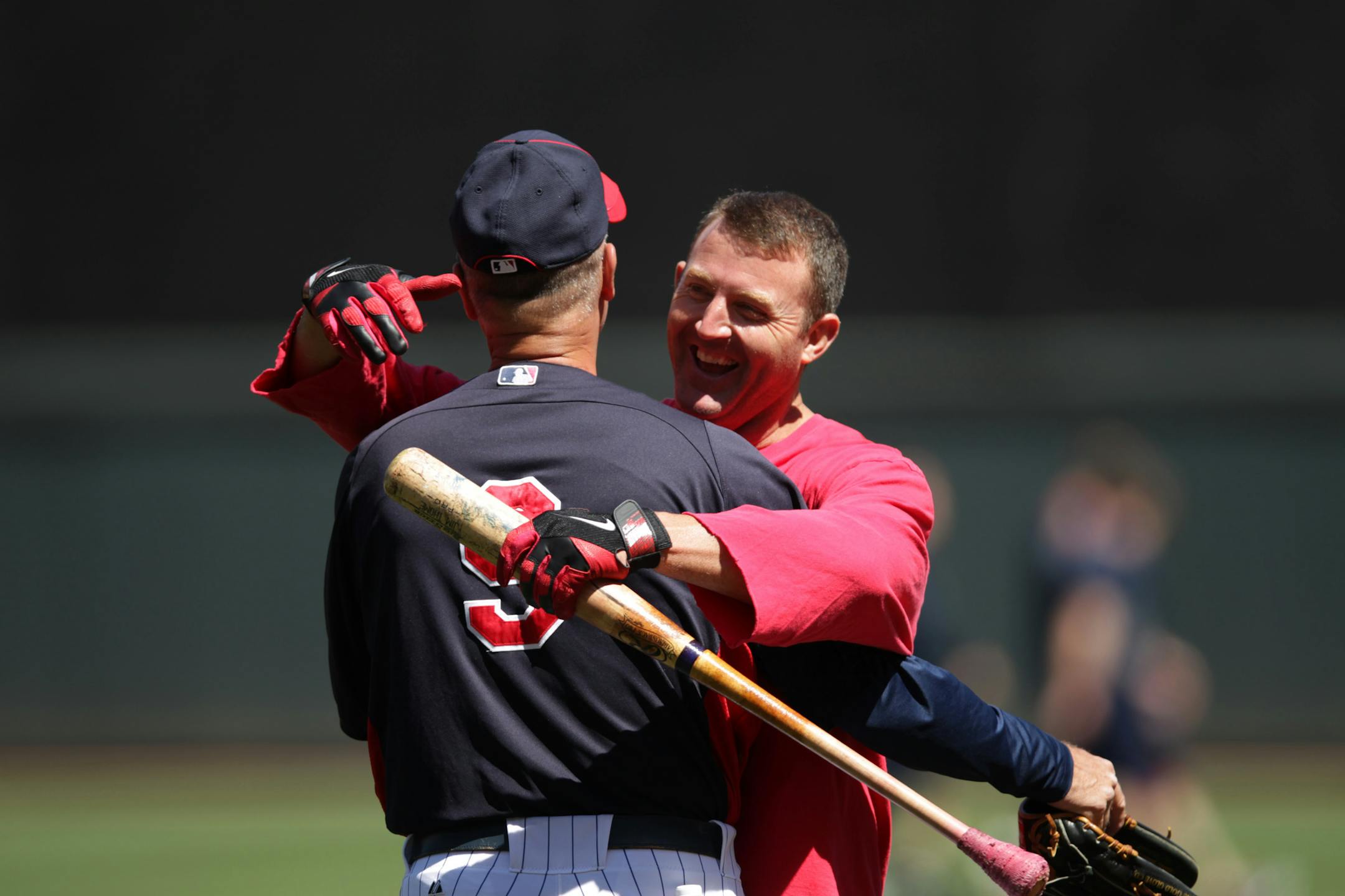 Former Minnesota Twins Jim Thome hugged Twins third base coach Steve Liddle during batting practice before the game with the Philadelphia Phillies June 12, 2012.