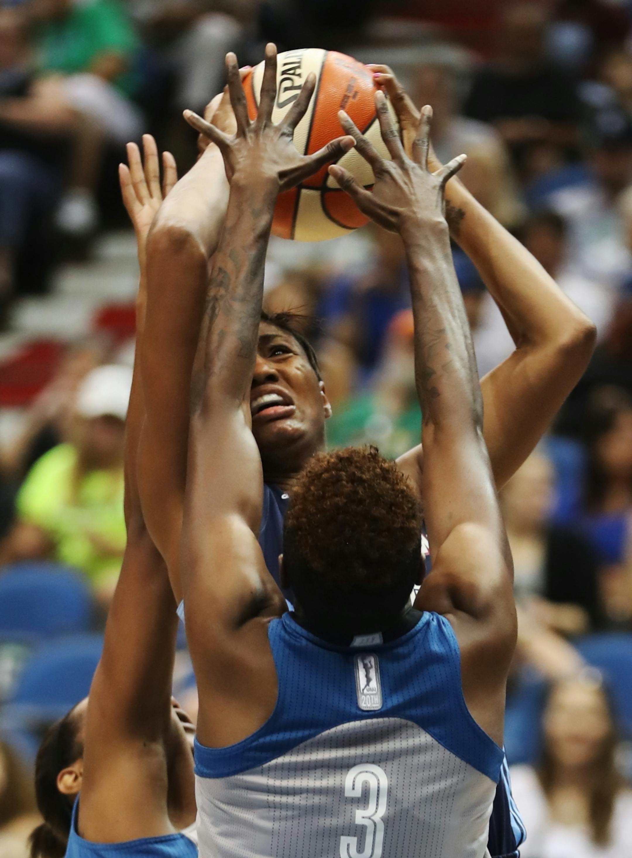 Natasha Howard(3) clamps down on Dream player Angel McCoughtry(35).