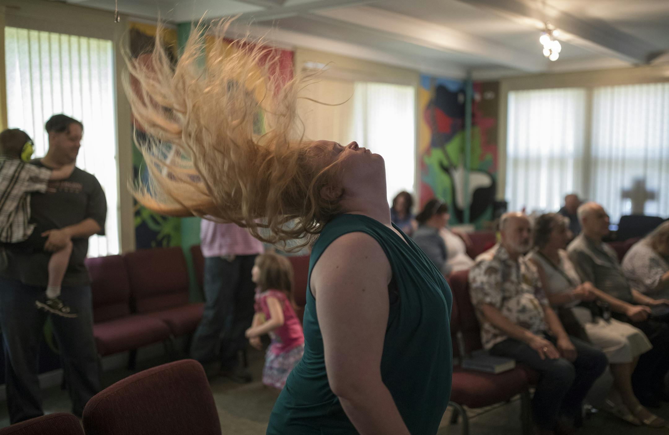 Katie King worshipped during church service at the Minneapolis Metal Church Sunday June 17, 2018 in Minneapolis, MN. ] JERRY HOLT ï jerry.holt@startribune.com