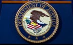 The Department of Justice seal is seen in Washington, Nov. 28, 2018.
