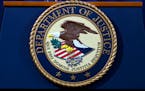 The Department of Justice seal is seen in Washington, Nov. 28, 2018. 