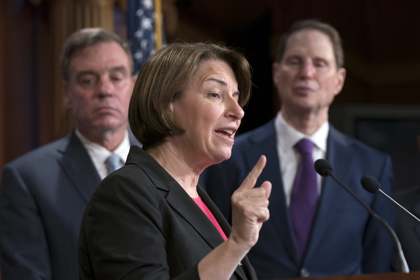 Sen. Amy Klobuchar, D-Minn., is flanked by several fellow U.S. senators at a news conference at the Capitol in Washington, Tuesday, July 23, 2019. (AP Photo/J. Scott Applewhite)